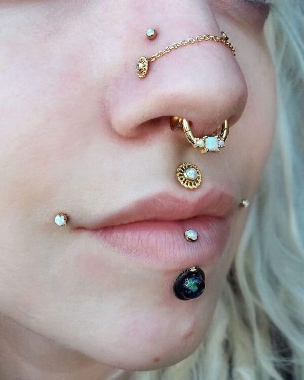 Chained nostril and philtrum piercings