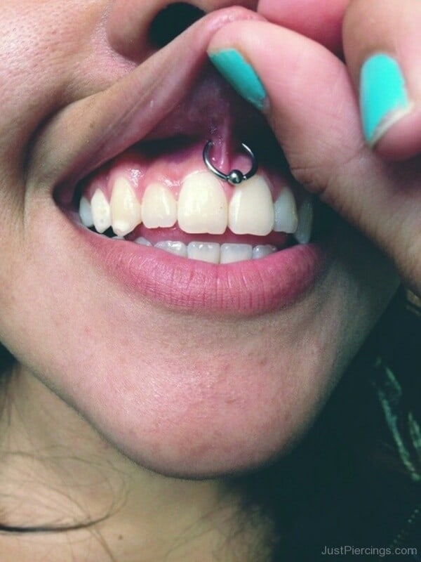 Upper lip frenulum piercing