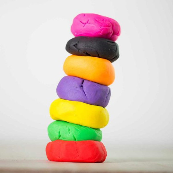 Child's hands playing with homemade play dough.