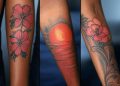 Red Tattoo On Dark Skin