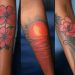 Red Tattoo On Dark Skin