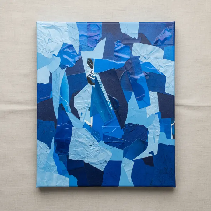 Monochromatic blue collage painting with tonal paper and acrylic layers