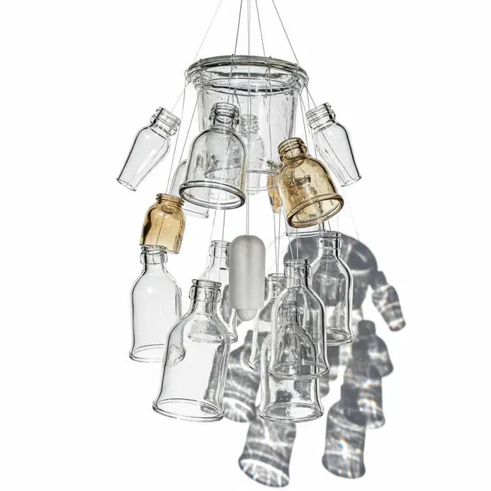 A wind chime made from repurposed glass bottles and jars