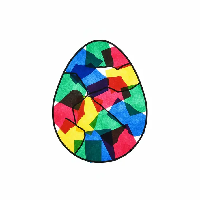 Tissue paper stained glass Easter eggs with light shining through.