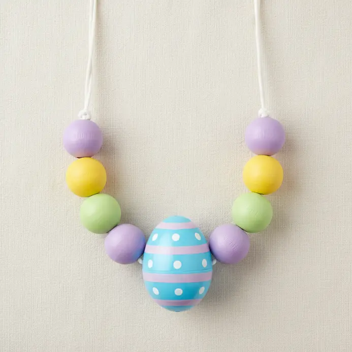 Colorful beaded necklaces featuring Easter egg charms.