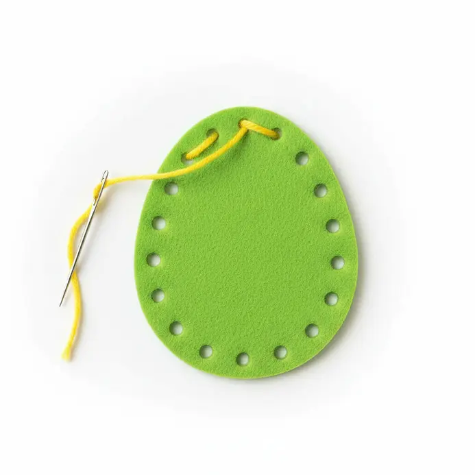 Felt Easter egg sewing cards with pre-punched holes and yarn.