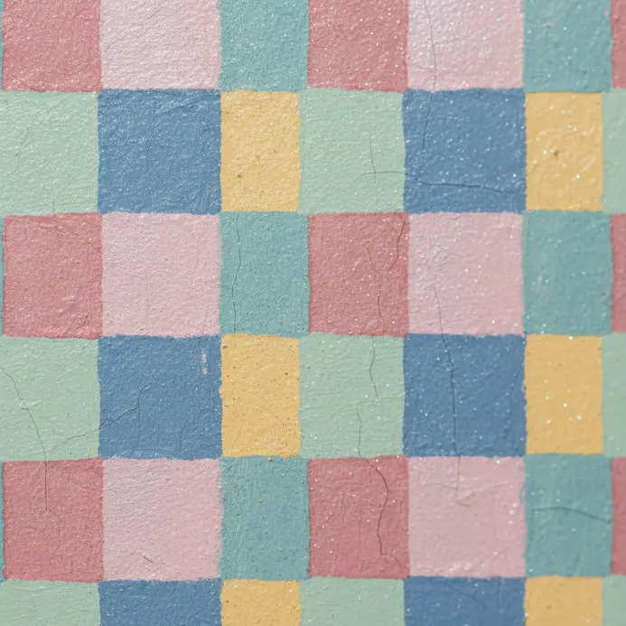 A textured gray wall finish resembling polished concrete.