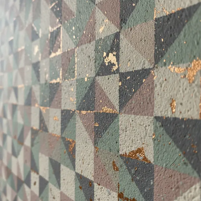 A white wall with a scattered terrazzo effect in pastel chips.