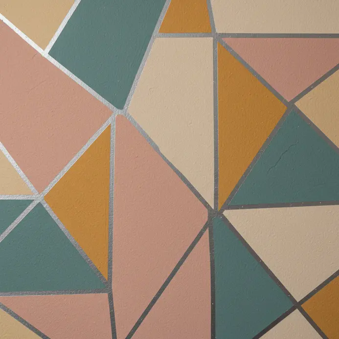 A wall painted dark green on bottom and white on top with a gold midline.