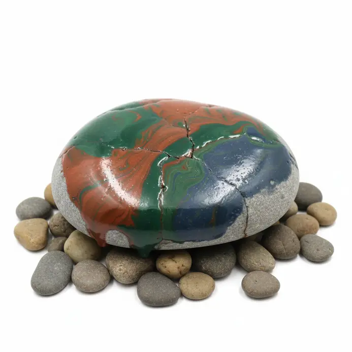 Colorful melted crayon designs adorning the surface of various rocks and stones.