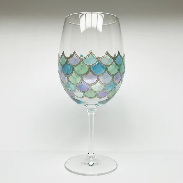 A wine glass drawing with a curved band of overlapping scale shapes around the lower bowl.