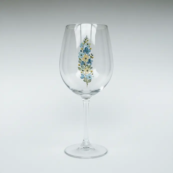 A wine glass sketch showing a vertical strip of small flower shapes placed along one side of the bowl.