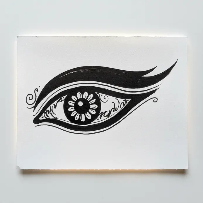 Thick brush pen sketch of an iconic Goddess Durga eye showing the classic elongated teardrop shape.