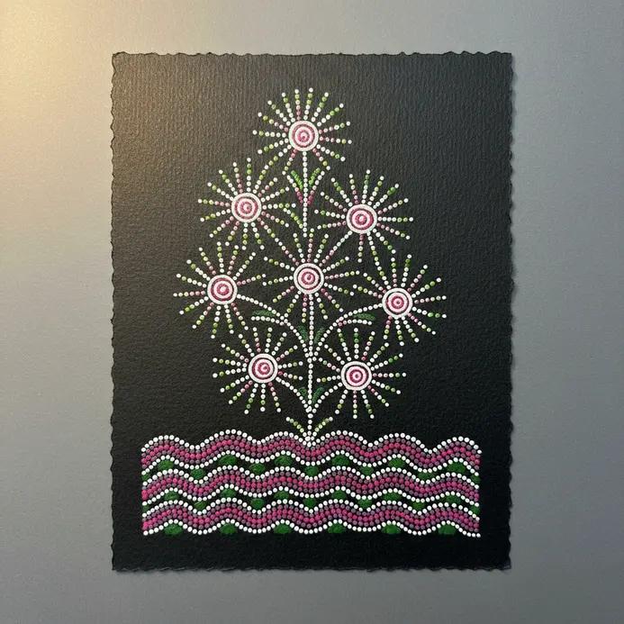 A vibrant green and pink acrylic drawing showing stylized flowers blooming from a dotted bed.