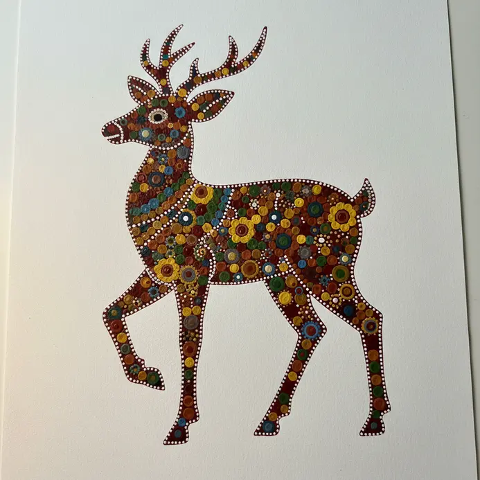 A stylized standing deer profile filled meticulously with white and orange acrylic dots on a dark clay background.