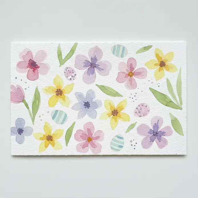 A greeting-card style rectangle filled with pressed flower shapes and light stems.