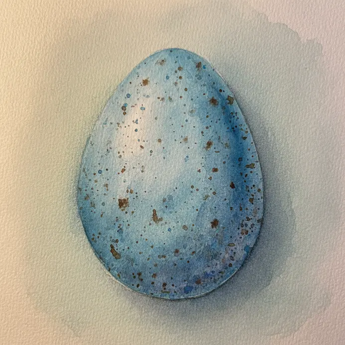 A blue egg shape with scattered dark speckles and a pale pencil outline on paper.