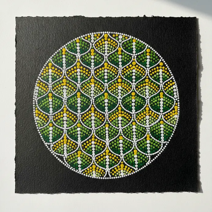 Repeated crescent shapes interlock tightly to resemble fish scales covering a large section of the subject.