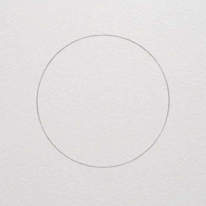 A single light pencil circle drawn in the center of white paper, serving as the anchor point for the flower.