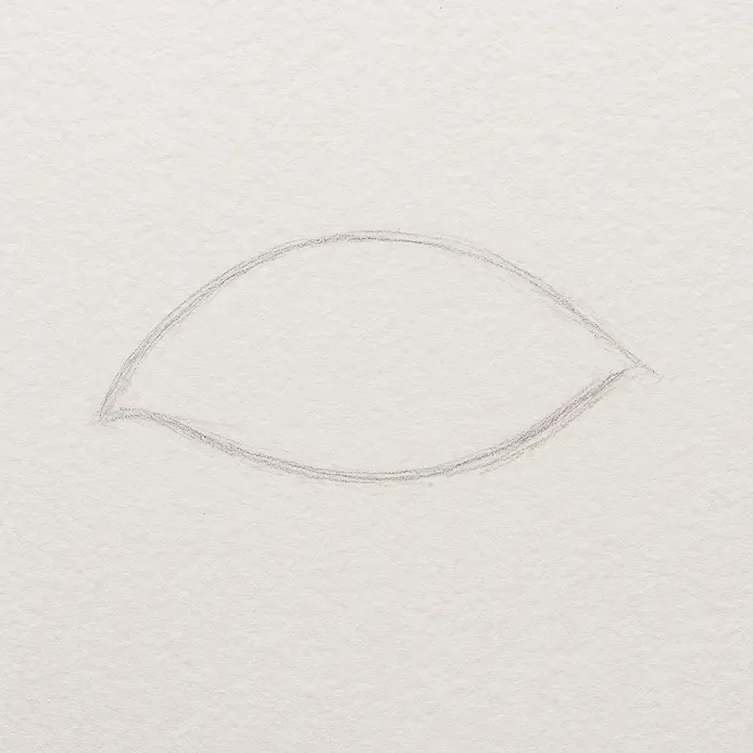 Light pencil strokes showing a curved top line and softer bottom line forming an almond eye shape on white paper.