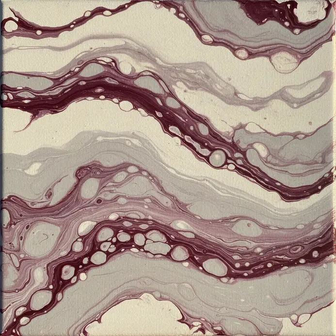 A glossy acrylic pour with elegant swirls resembling marble stone.