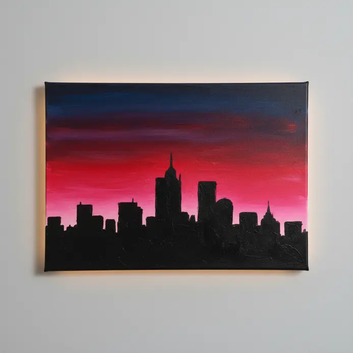 A jagged city skyline silhouette in black acrylic paint against a vibrant sunset background.