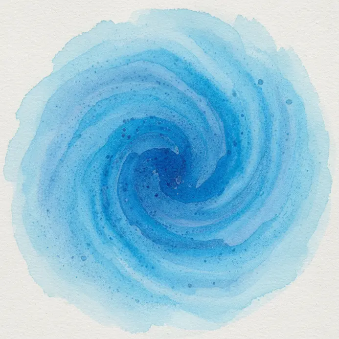 A wet round brush swirls in a pan of blue watercolor paint, creating a rich pigment pool.