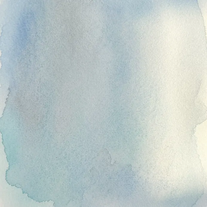A smooth, even rectangle of pale blue watercolor wash painted on cold-press paper.