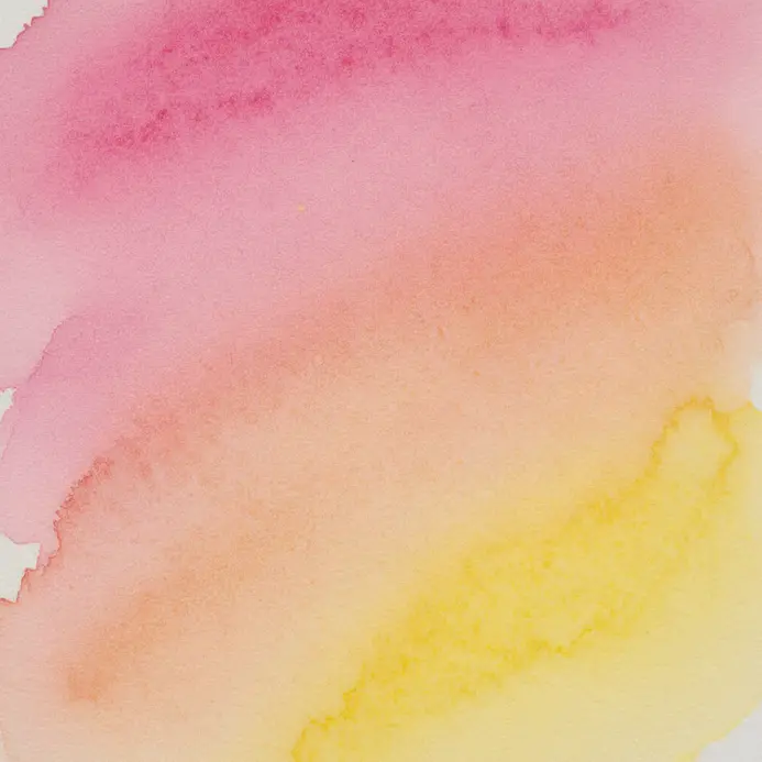 Blue and yellow watercolor paints bloom and blend together on a wet sheet of paper.
