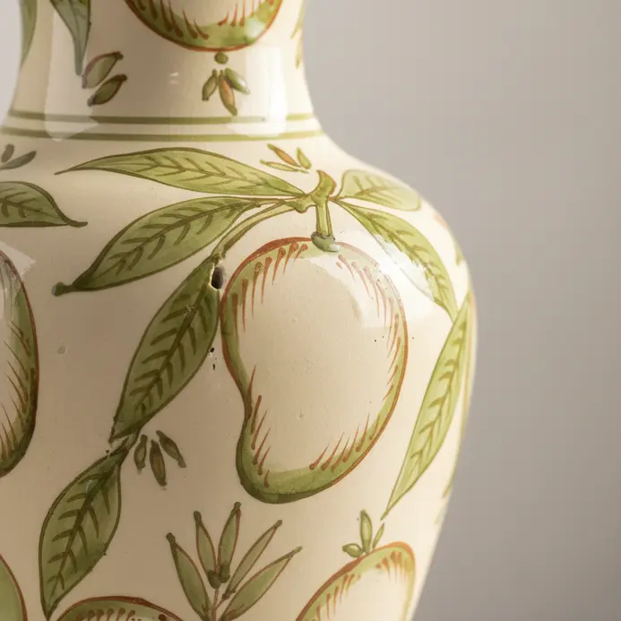 A set of plain ceramic vases hand-painted with green and gold mango leaf designs.