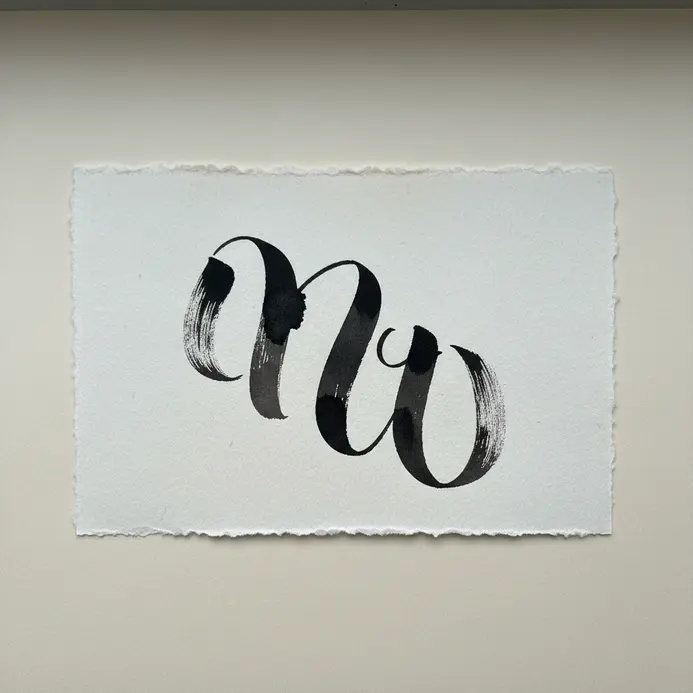 A hand-lettered scrapbook title card with black ink calligraphy reading 'Summer Days' on cream paper.