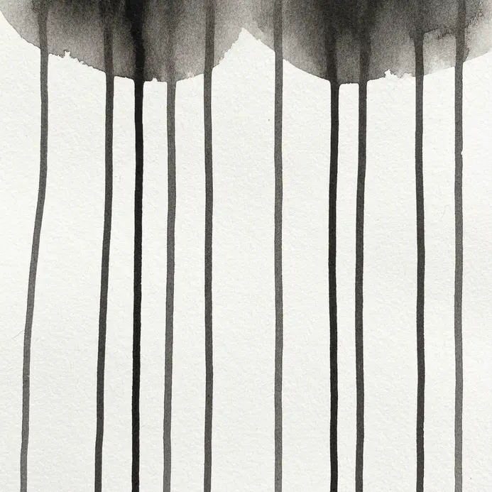 Vertical lines of black watercolor ink dripping down the paper to create a rhythmic pattern.