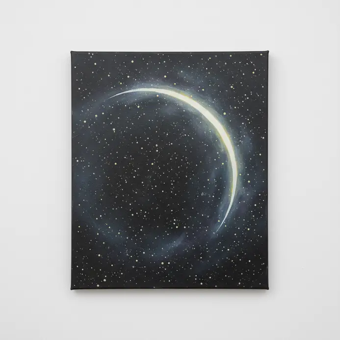 A delicate crescent moon shape painted with white acrylic paint on a dark galaxy background.