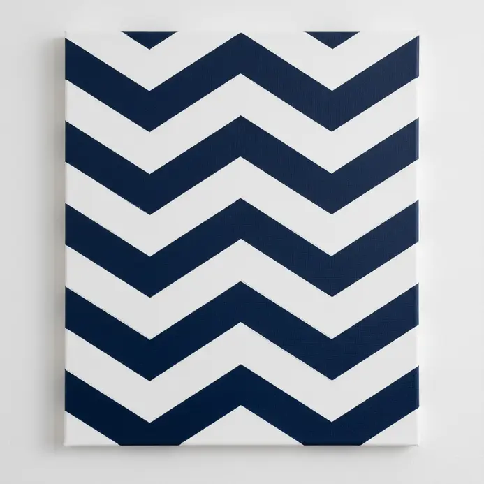 A crisp white chevron pattern revealed through negative space on a solid blue acrylic painted canvas.