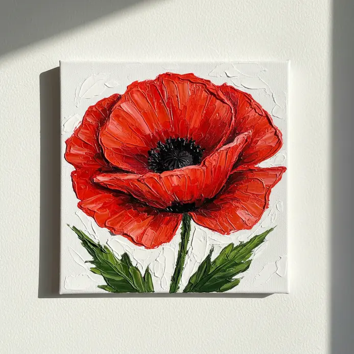 A close-up view of a red poppy flower with petals built up high from the canvas using heavy modeling paste and paint.