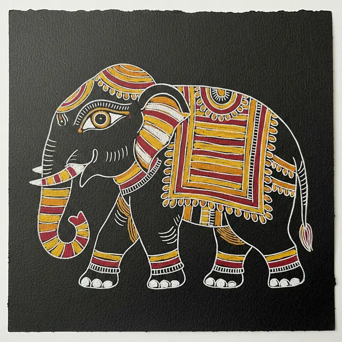 A side-view elephant outline with a large, expressive eye and simple internal decorations.