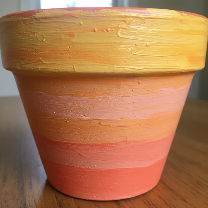 Horizontal bands blending from yellow to orange to pink, creating a sunset effect.