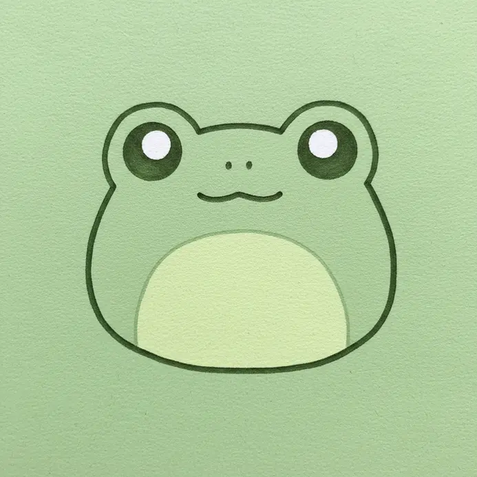 A circular green frog face with big, widely spaced eyes and a small smiling mouth.
