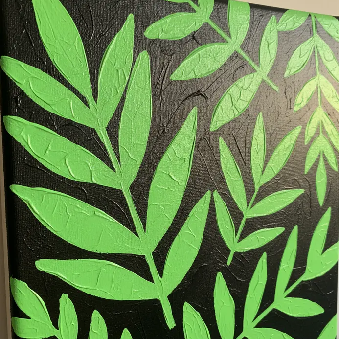 Black silhouettes of various leaves filled with solid neon green paint on a white background.