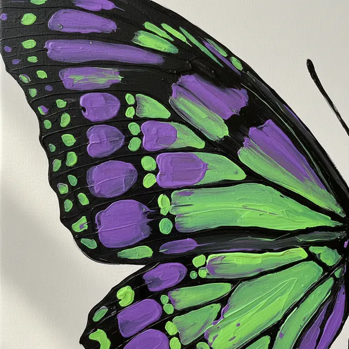 A close-up view of a butterfly wing pattern painted with neon purple and green cellular shapes.