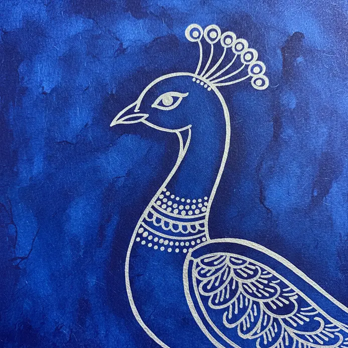 Fine, decorative lines and dots painted in white on the peacock's blue neck.