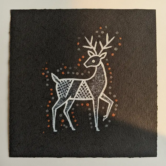 A deer in profile, composed of a circle for the head and triangles for the body and antlers.