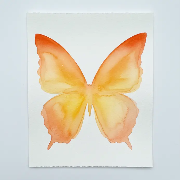 Two abstract butterfly wings featuring a gradient from orange to yellow watercolor.