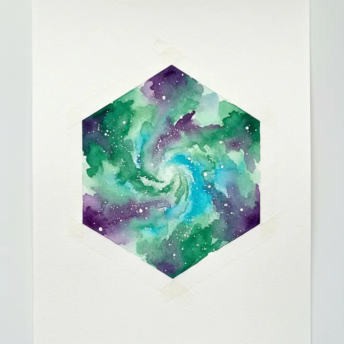 A geometric hexagon shape containing a perfectly framed watercolor galaxy composition.