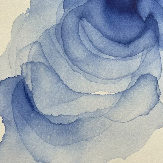 A translucent indigo ink wash creating soft, overlapping ripple patterns on paper.