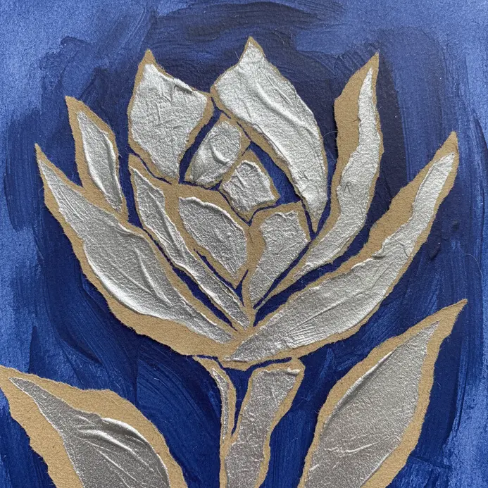 A page from a sketchbook showing layered paper, paint strokes, and handwritten text.