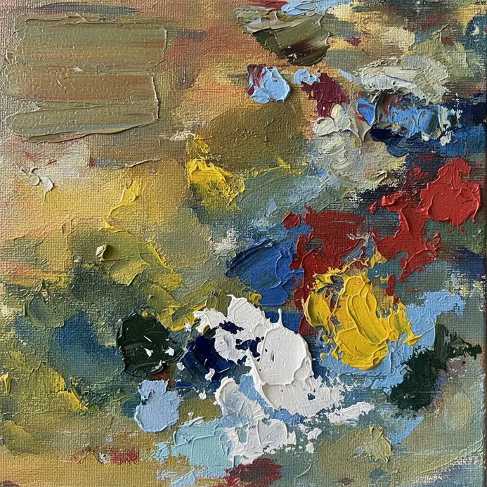 A wide brush applies a smooth layer of white gesso onto a stretched canvas.