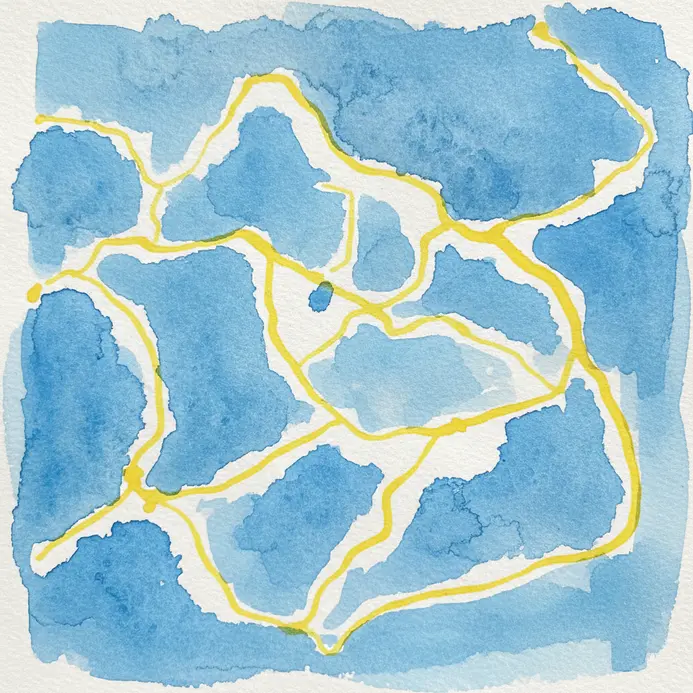 A detail of watercolor paper with yellow masking fluid lines, surrounded by a blue wash.