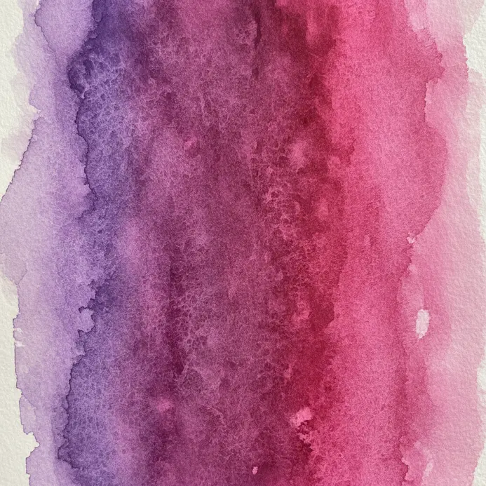 A violet and a magenta watercolor seamlessly blended into one another on damp paper.