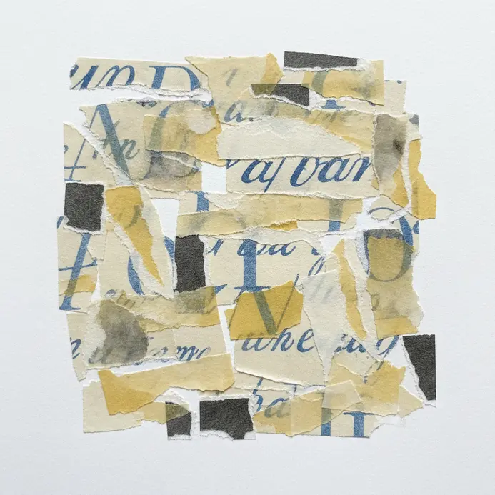 A scrapbook page background made from torn pieces of handwritten letters, with a photo mounted on top.